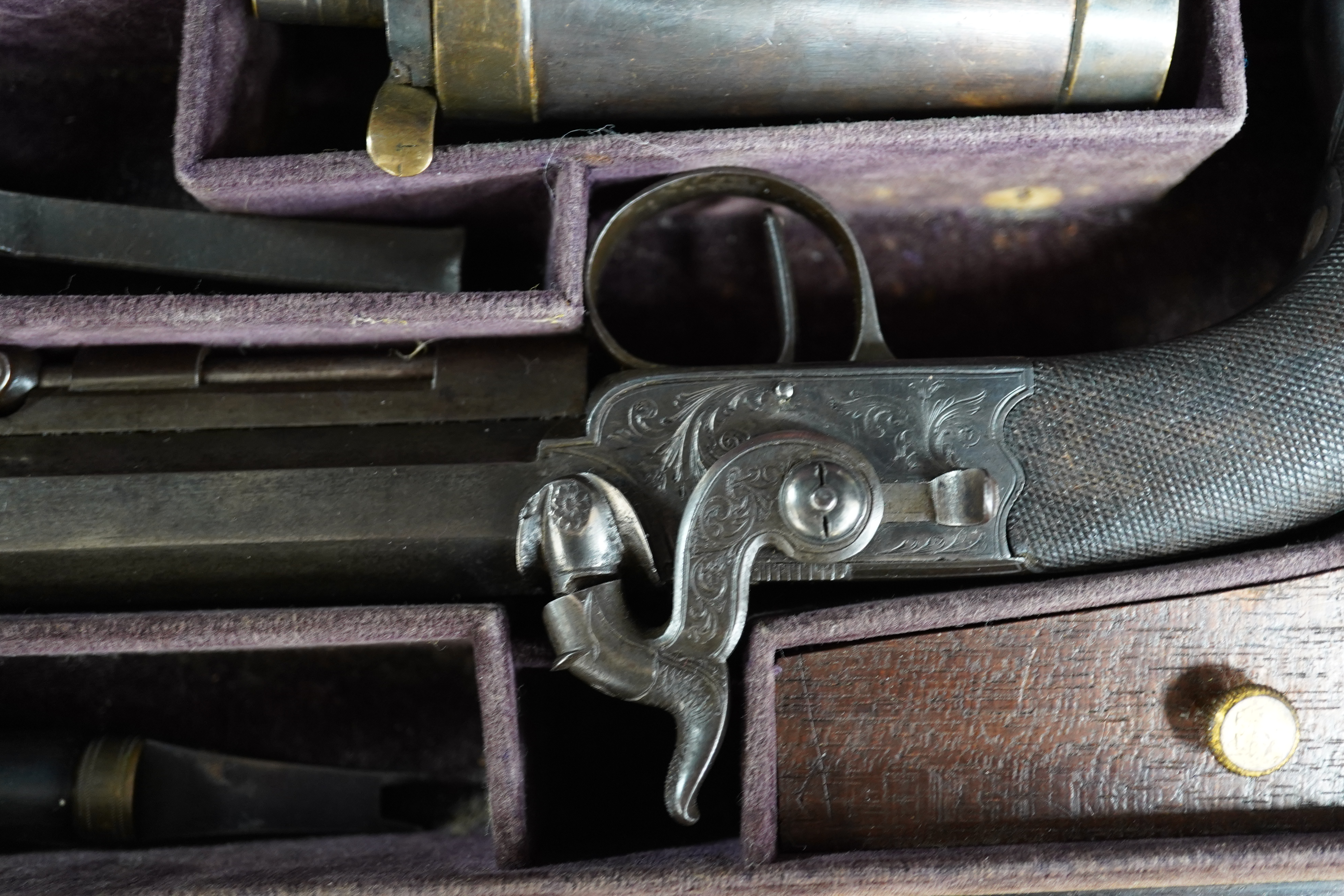 A pair of rosewood cased Blake & Co. London percussion cap travelling pistols, with octagonal barrels, engraved Blake & Co. London, Birmingham proof marks, side hammers, sliding safety bolts, swivel ramrods, foliate engr